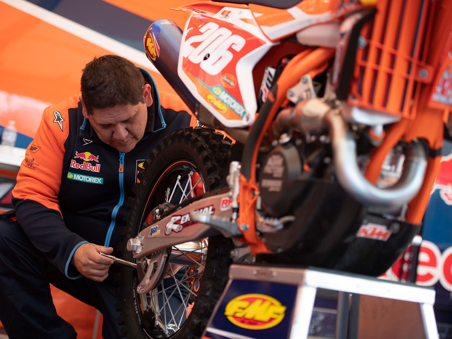 KTM factory mechanic Charles Marchant checks the spokes on Josh Toth’s bike before a race.