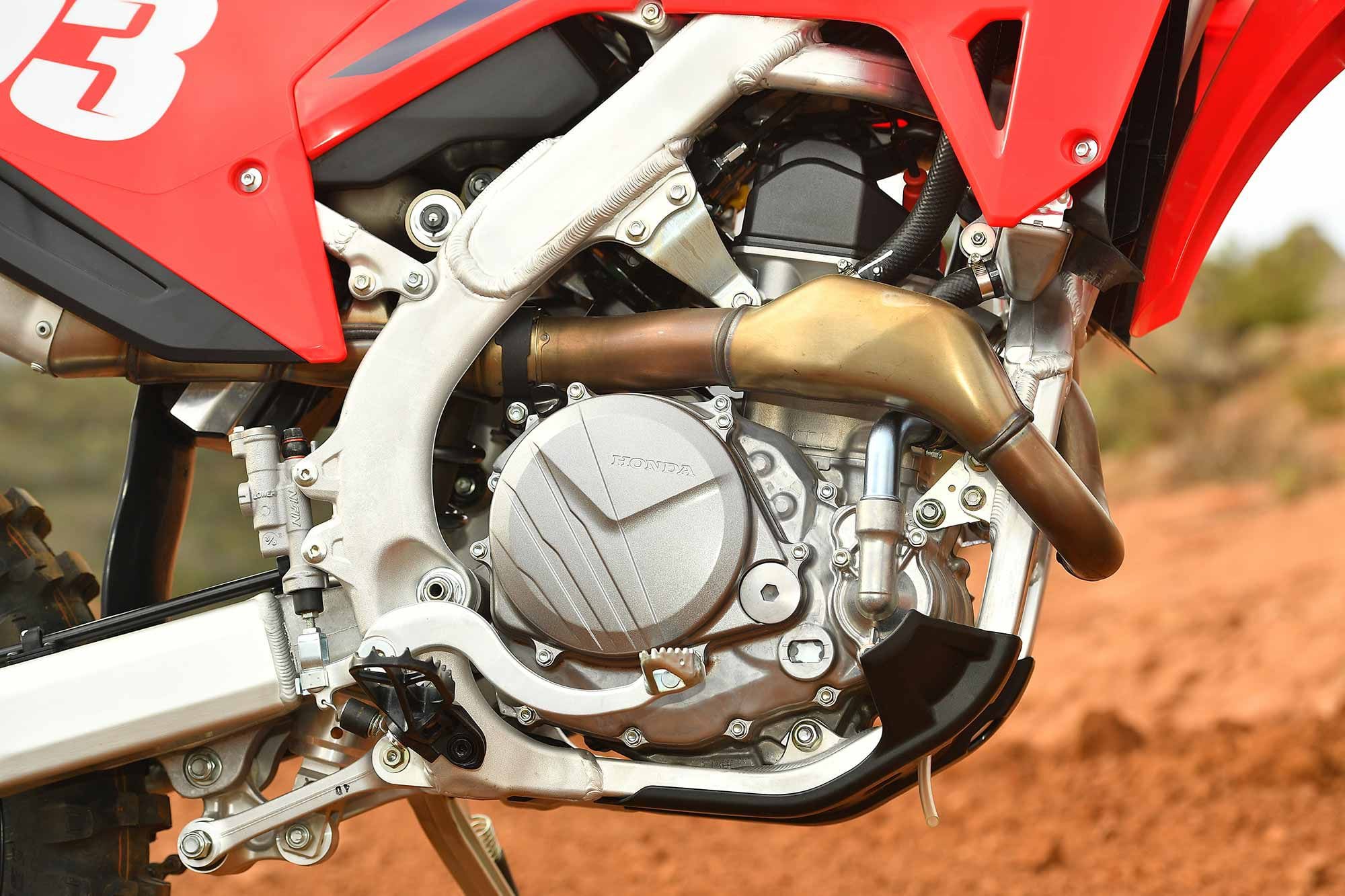 Most Honda dirt bike clutch covers don’t look this clean for long. Also, the externally visible engine oil sight glass is a marked improvement over dipstick designs of old.
