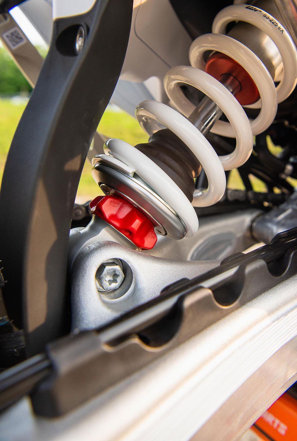 Unlike the SX-F and XC-F models, the 450 XCF-W uses a WP Xplor PDS (Progressive Damping System) shock with tool-free adjusters for low- and high-speed compression damping, and this nice big red dial for rebound damping adjustment.