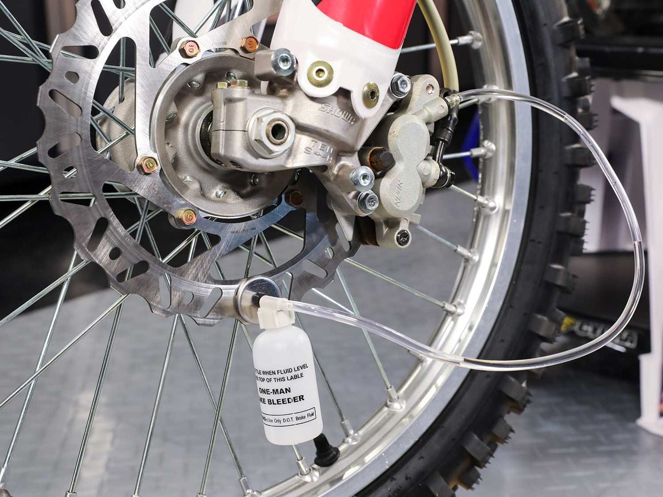 Bleeding brakes on a dirt bike.