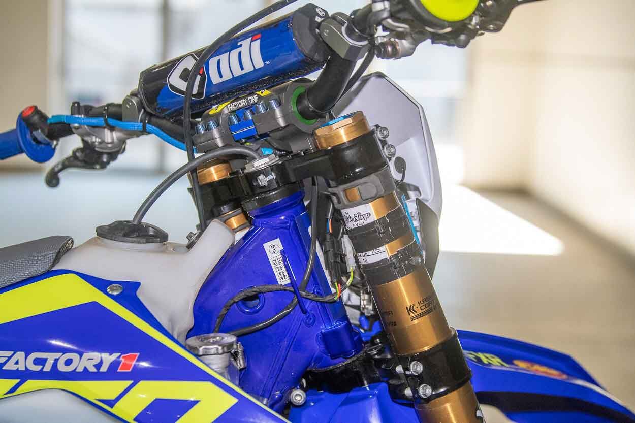 Neken triple clamps and the KYB 48mm coil-spring fork are what come on the bike, but there is an aftermarket ODI handlebar with titanium bolts throughout. Abbott has always run his fork tubes on the second line from the top.