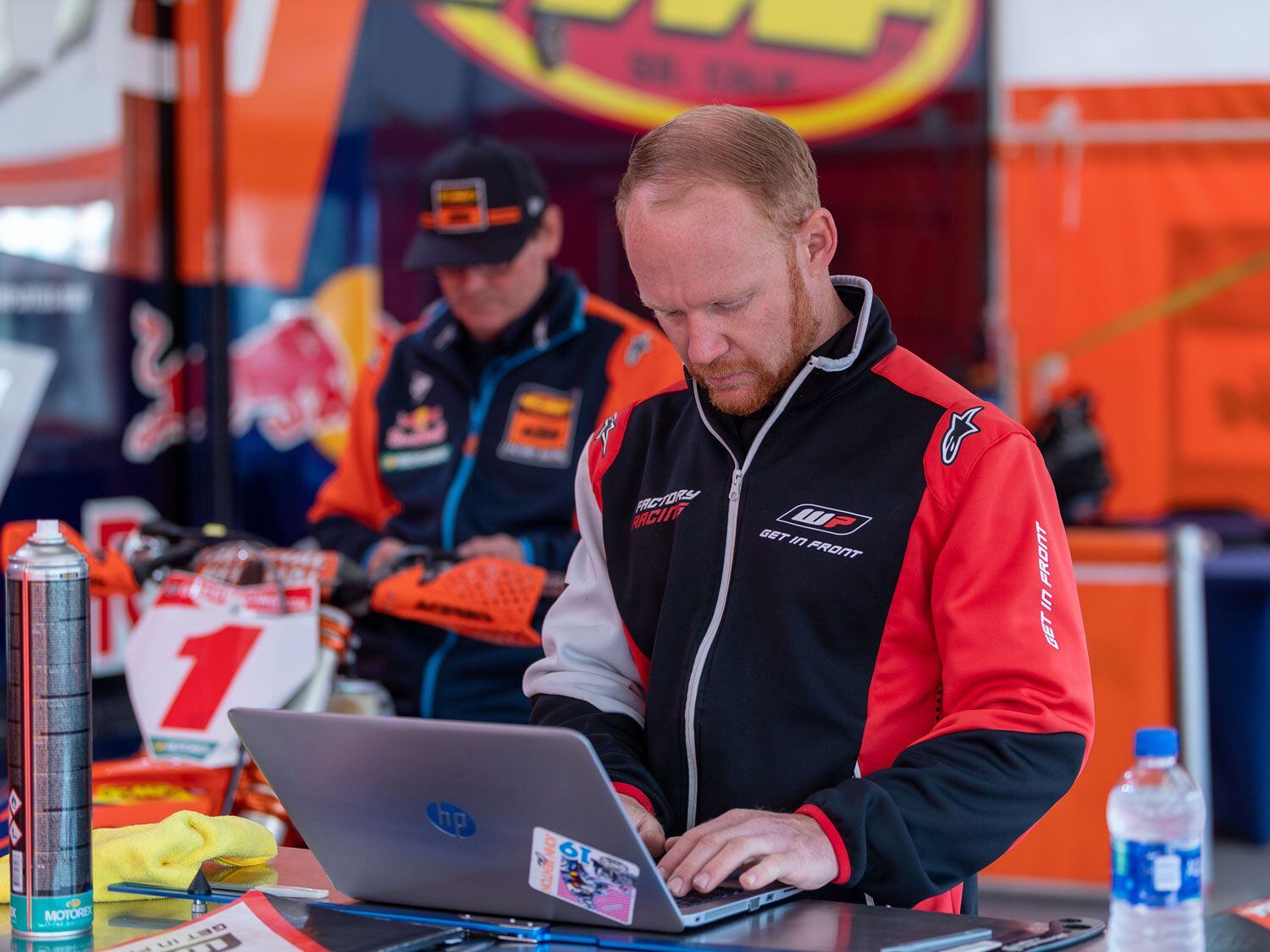 Suspension guru Leon Hansen goes over notes while working on Kailub Russell’s suspension.