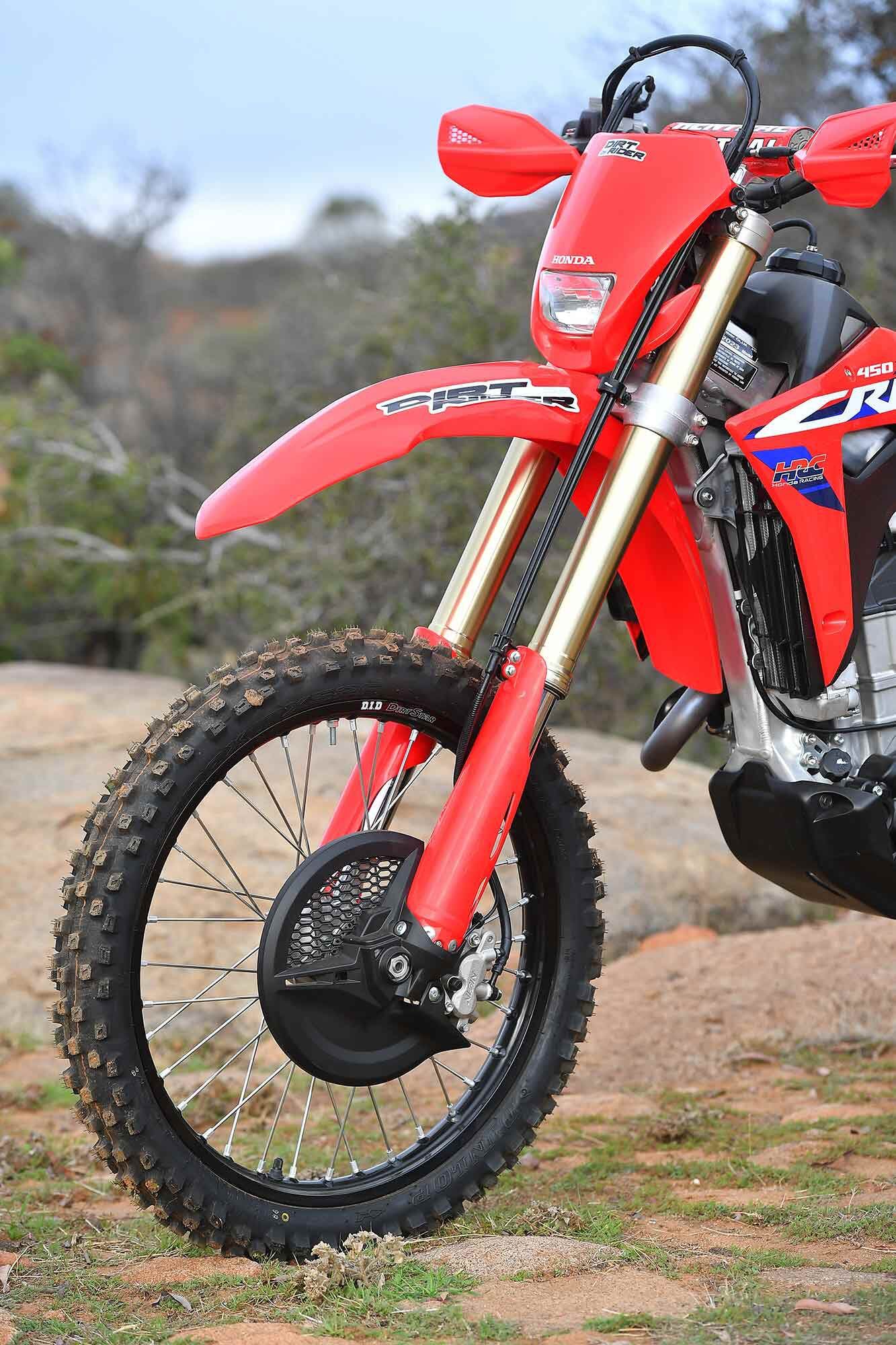 Halogen headlight, hand guards, Dunlop Geomax MX52 tires, black D.I.D DirtStar rims, a proper stock skid plate, and 2.0-gallon titanium fuel tank make the CRF450X trail ready right off the showroom floor.