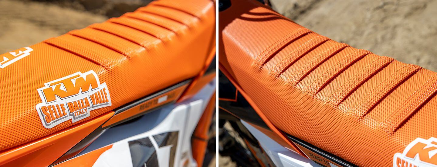 An orange Factory Racing seat cover features ribs for extra grip while sitting. The Selle Dalla Valle logo is unmistakable too.