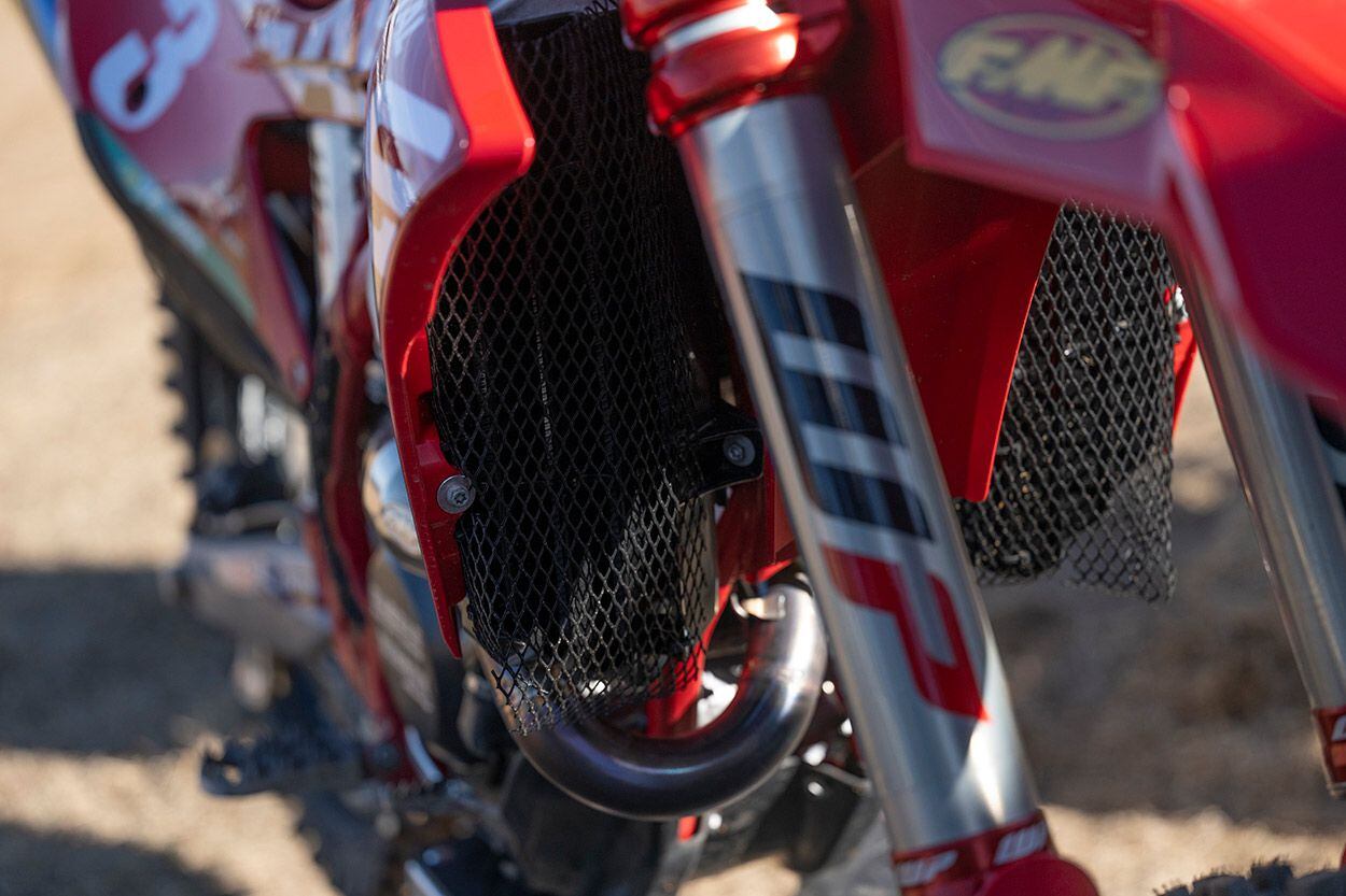 Oversize radiators feature hand-made guards and a fan that can be turned on and off via a switch behind the front number plate.