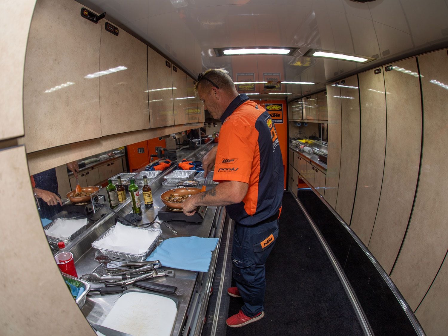 Brian “Rabbit” Sweet prepares a meal on Saturday for the team.