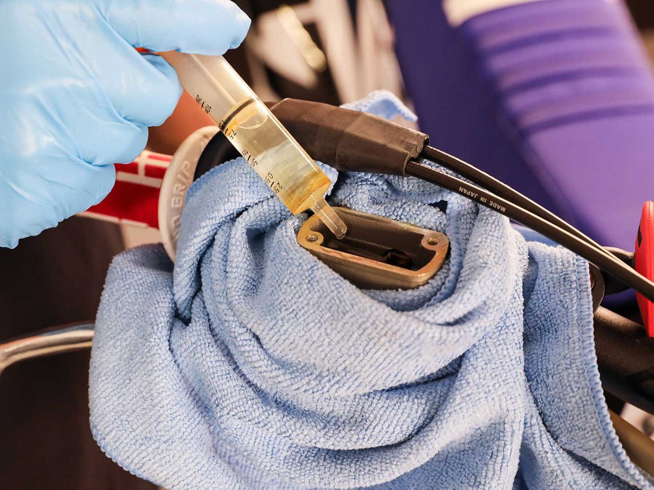 Keeping the fluid level in the master cylinder with a plastic syringe.