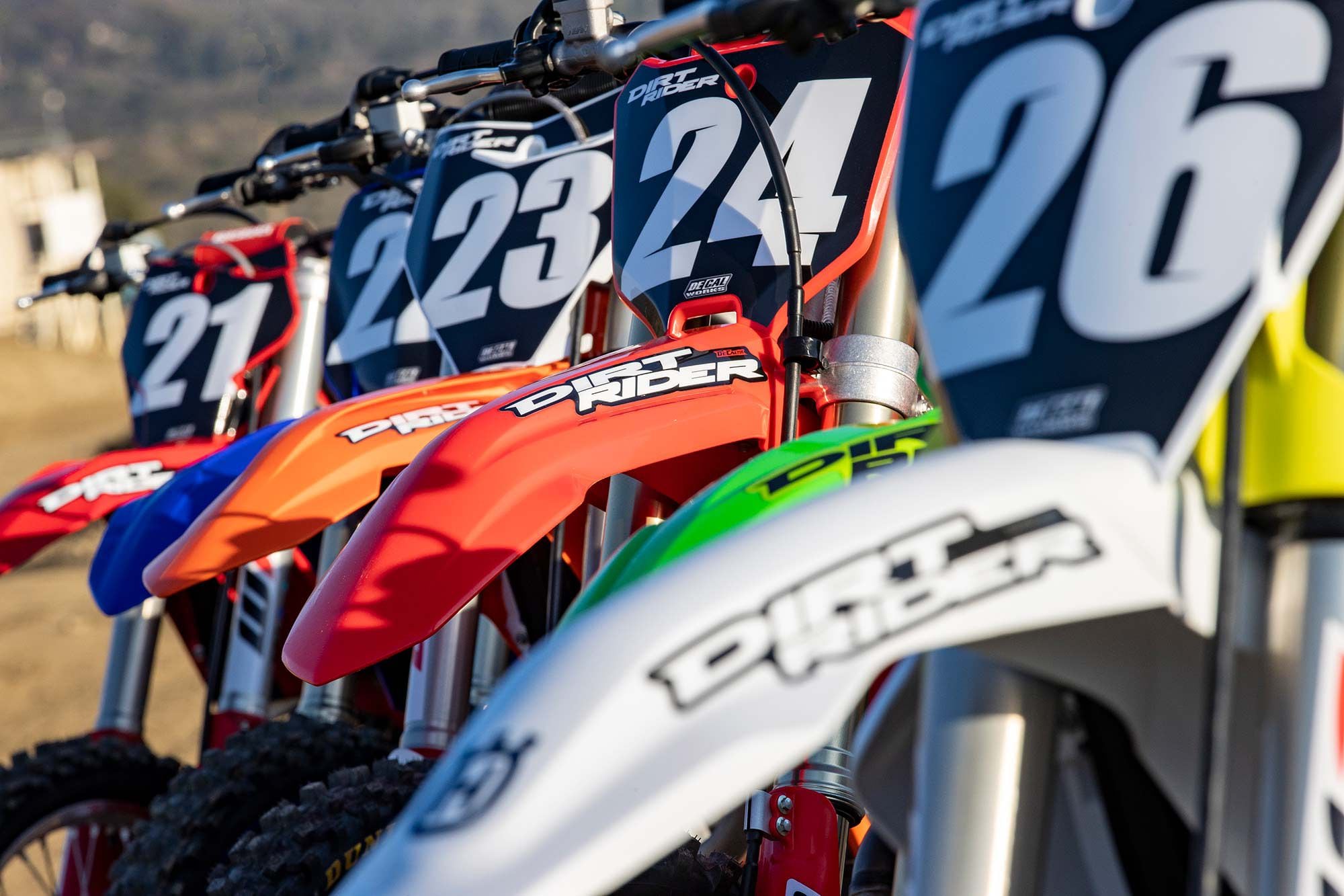 Preprinted number plate backgrounds and arched front fender stickers for each machine were provided by DeCal Works.