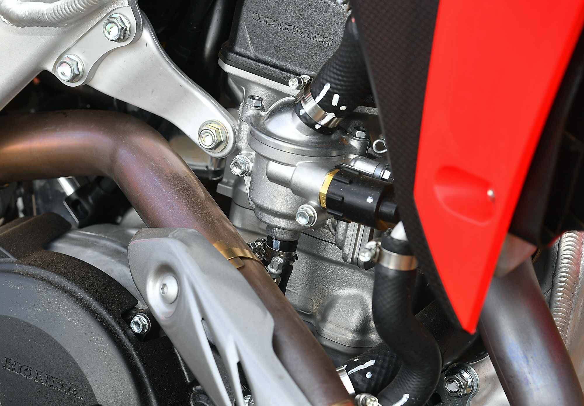 Differing from the closed-course competition models, the CRF450X comes with emissions safeguards. Not as extensive as the street-legal CRF450RL, yet still California green-sticker compliant.