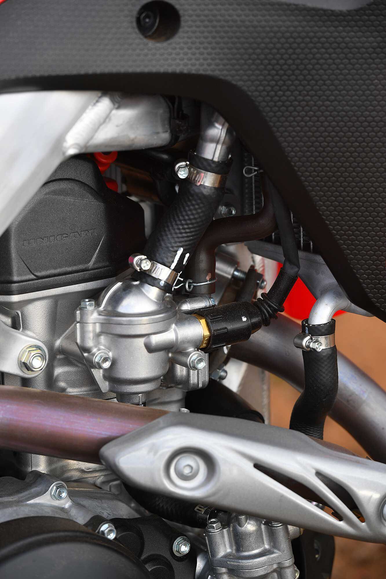 Close-up of the thermostat with plug-in sensor and textured radiator shroud plastic.