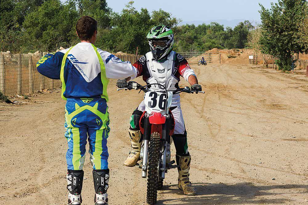 Boys riding hotsell dirt bikes
