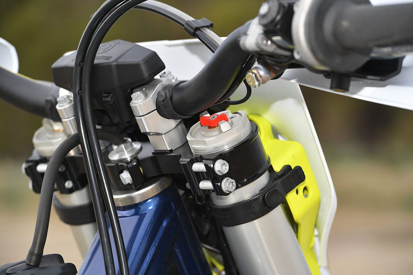The WP Xplor 48mm open-cartridge coil-spring fork offers compression and rebound damping adjusters with a three-position external preload adjustment on each leg.