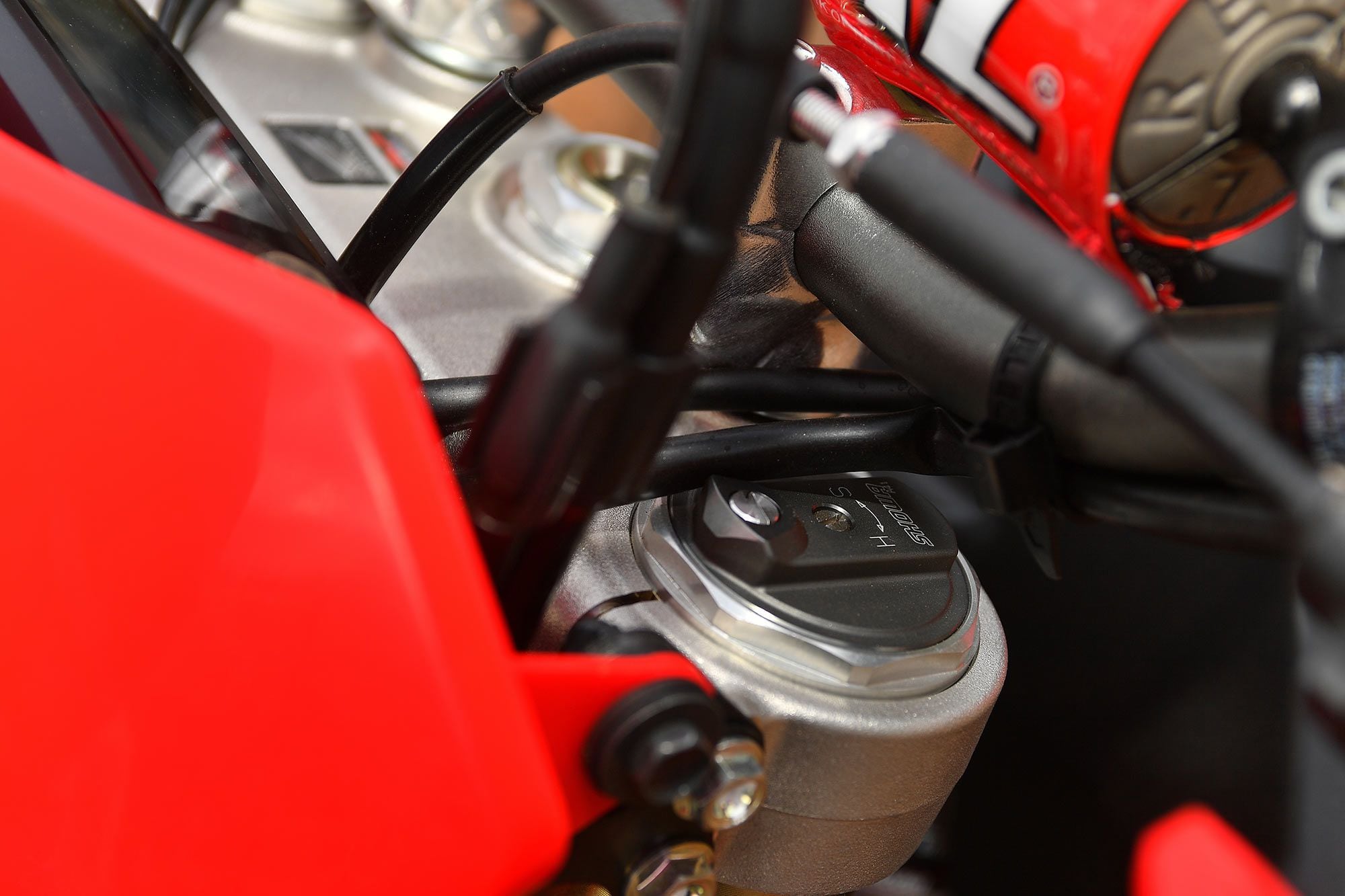 Fork height placement was flush on our test bike this day. Although they appear identical to the units on other Honda 450 models, the Showa 49mm coil-spring components are valved and sprung appropriately for intended CRF450X trail terrain.