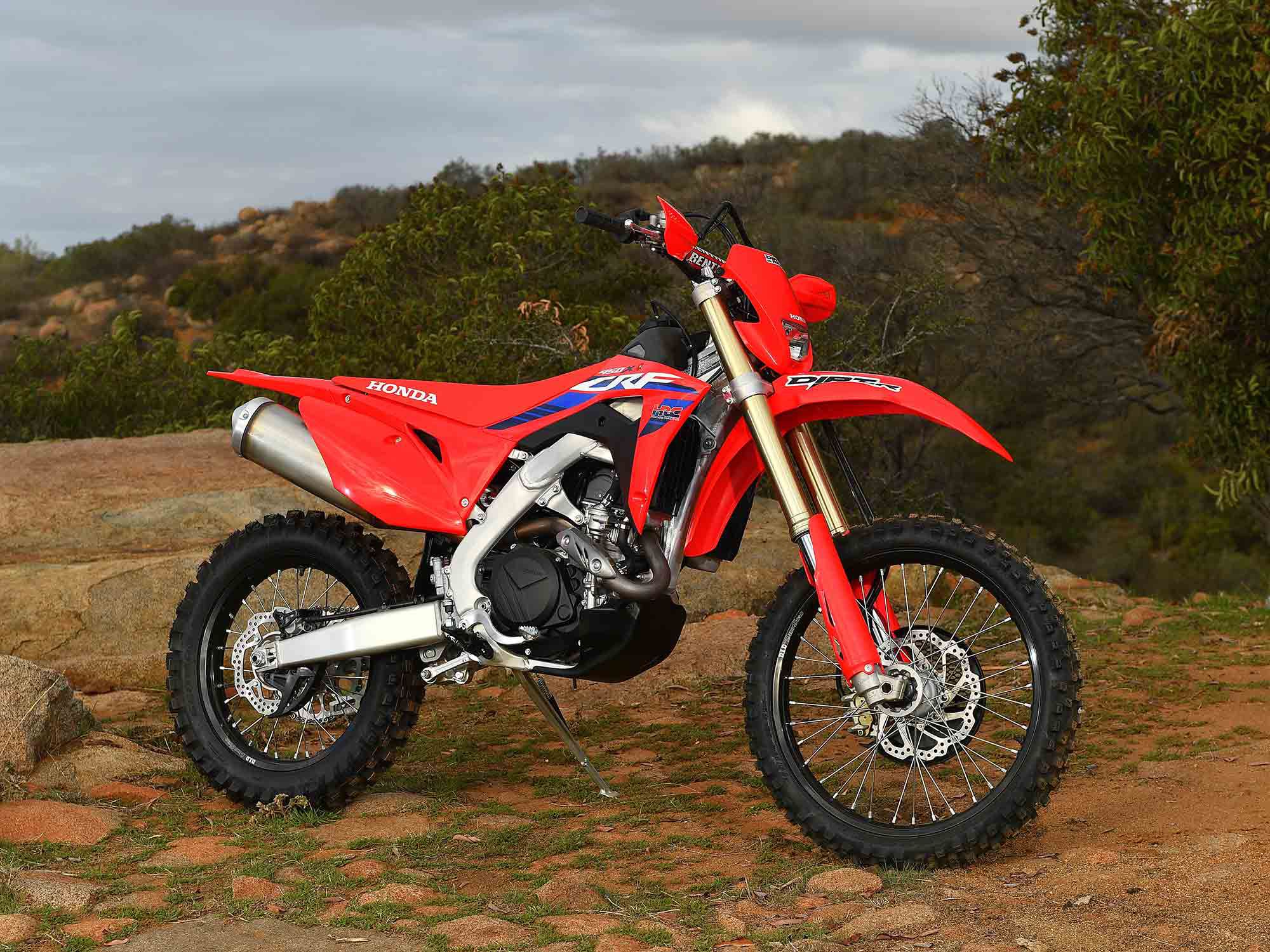 Right-side beauty shot in its natural habitat. New graphics for 2023 and updated HRC logo make this year’s CRF450X one of the cleanest designs in recent memory.