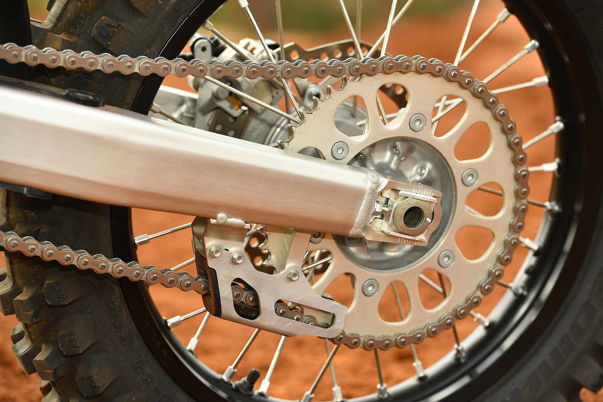 A 50-tooth rear sprocket comes standard on the CRF450RX, whereas the CRF450R gets spec’d with a 49-tooth. A common modification is to run longer chain/taller gearing combos for more length and chassis stability. The standard axle position is quite forward, especially compared to that of the CRF450X.