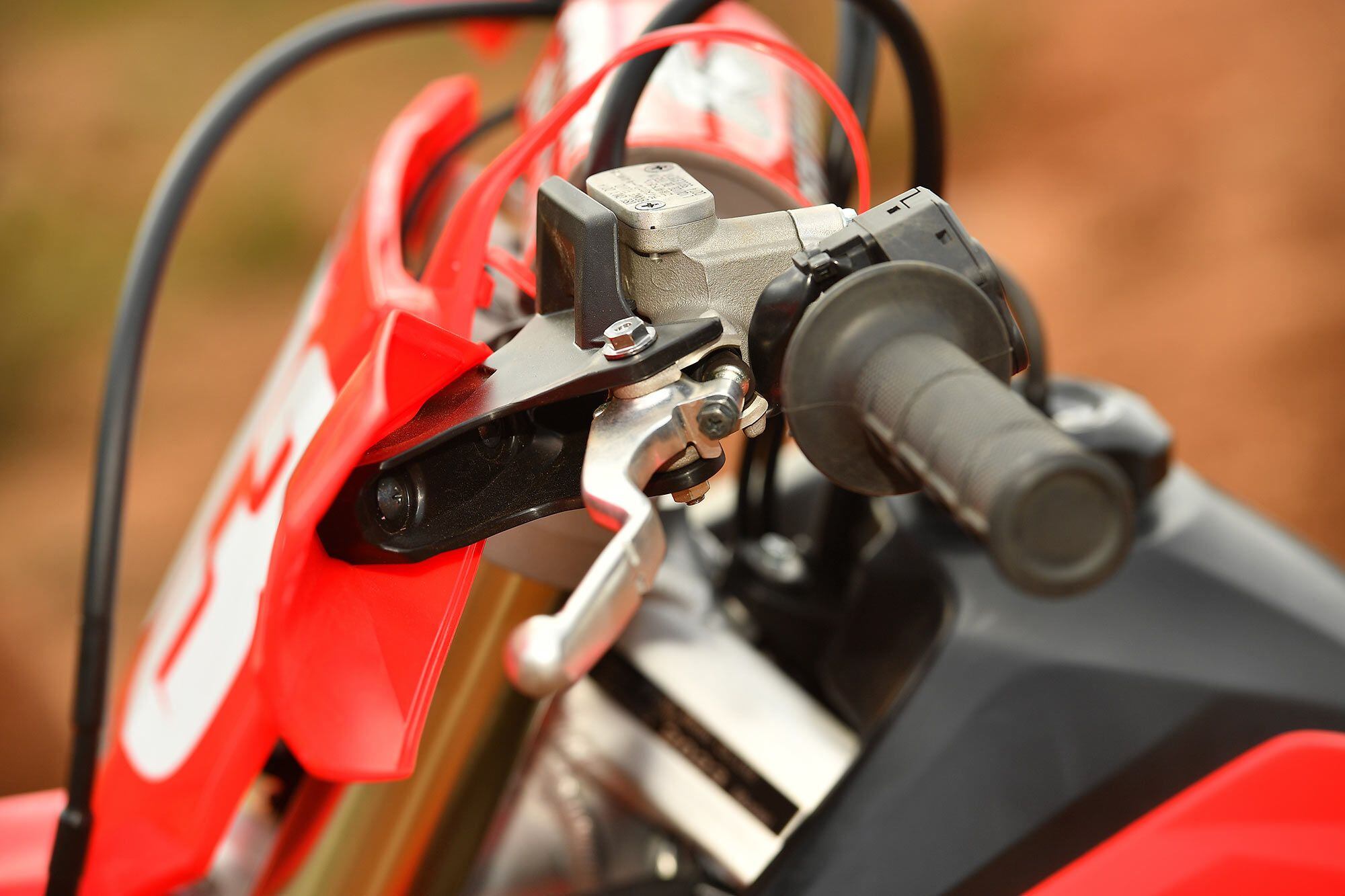 Honda’s standard-equipment hand guards work quite well. Utilizing the clutch and front brake lever bolts, no handlebar space is impacted. If any CRF owners who run Renthal Twinwall handlebars are interested in saving precious bar space, the RX guards and accompanying bolt hardware fit right on the CRF250R and CRF450R models as well.