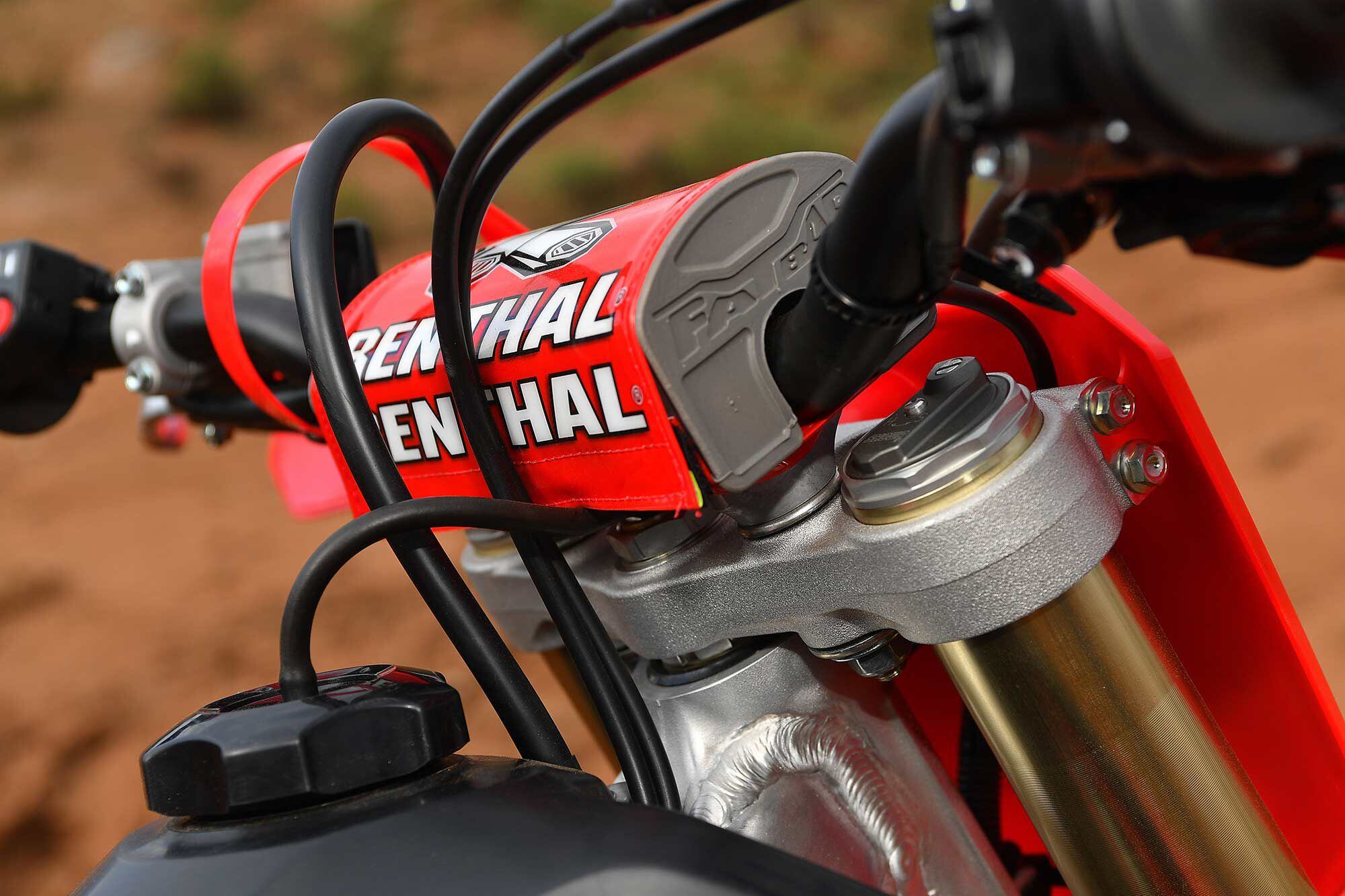 A Renthal Fatbar 839-bend handlebar graces the CRF450RX and multiple bar mount locations provide 26mm of cockpit adjustment to accommodate riders of all sizes. Interesting to note the standard fork height placement: Running the fork flush yields more stability, whereas closer to 5mm makes the RX even more nimble. This middle setting worked well for the tight and technical conditions we encountered at Honda’s off-road introduction.