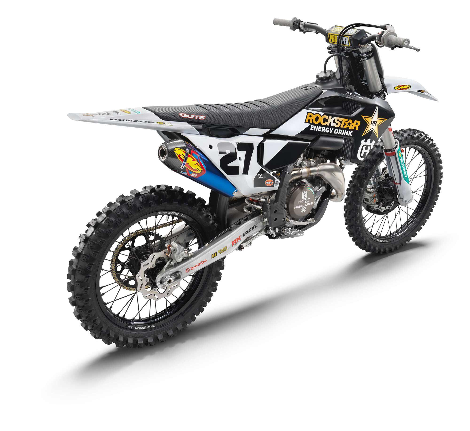 The blue-anodized titanium body of the FMF Factory 4.1 RCT muffler makes a striking statement against the dirt bike’s white and black bodywork.