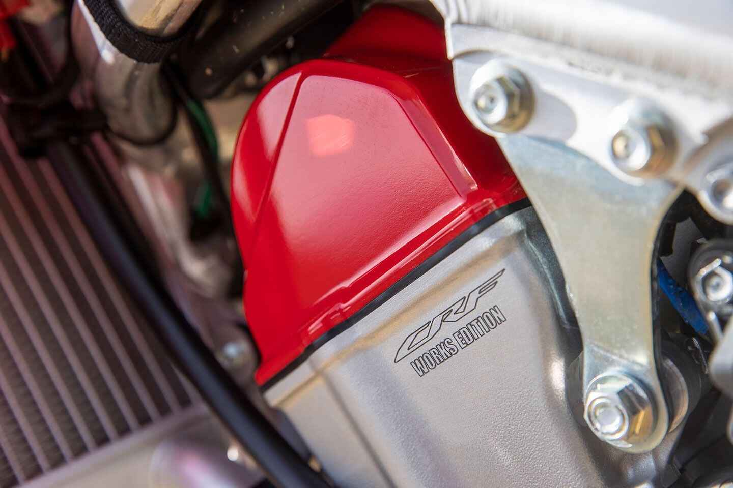 The red valve cover immediately draws one’s attention, and the Works Edition engraving is an extra touch. From this angle, the steel upper engine hangers are also visible; a change from the aluminum units on 2021 and 2022 models.