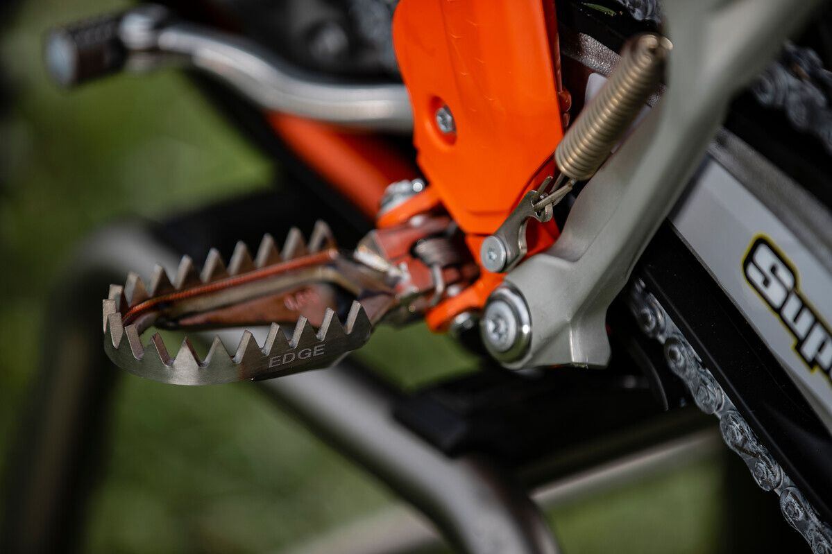 Footpegs won’t be Raptor Titanium Edge units, but will likely be new and repositioned inward on the frame.