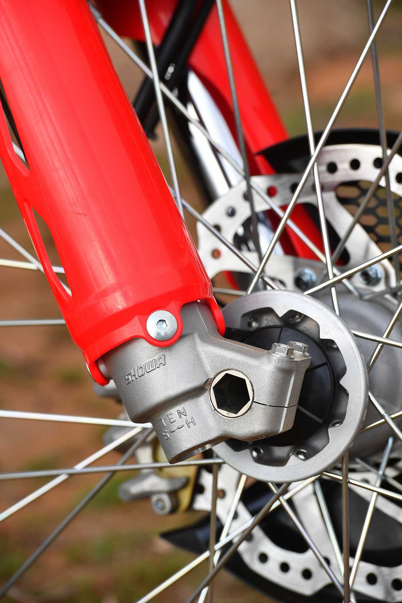 Showa 49mm coil-spring forks are quality OEM pieces and are tailored to the CRF450X with model-specific lugs and valving. Perfect front axle placement as well!