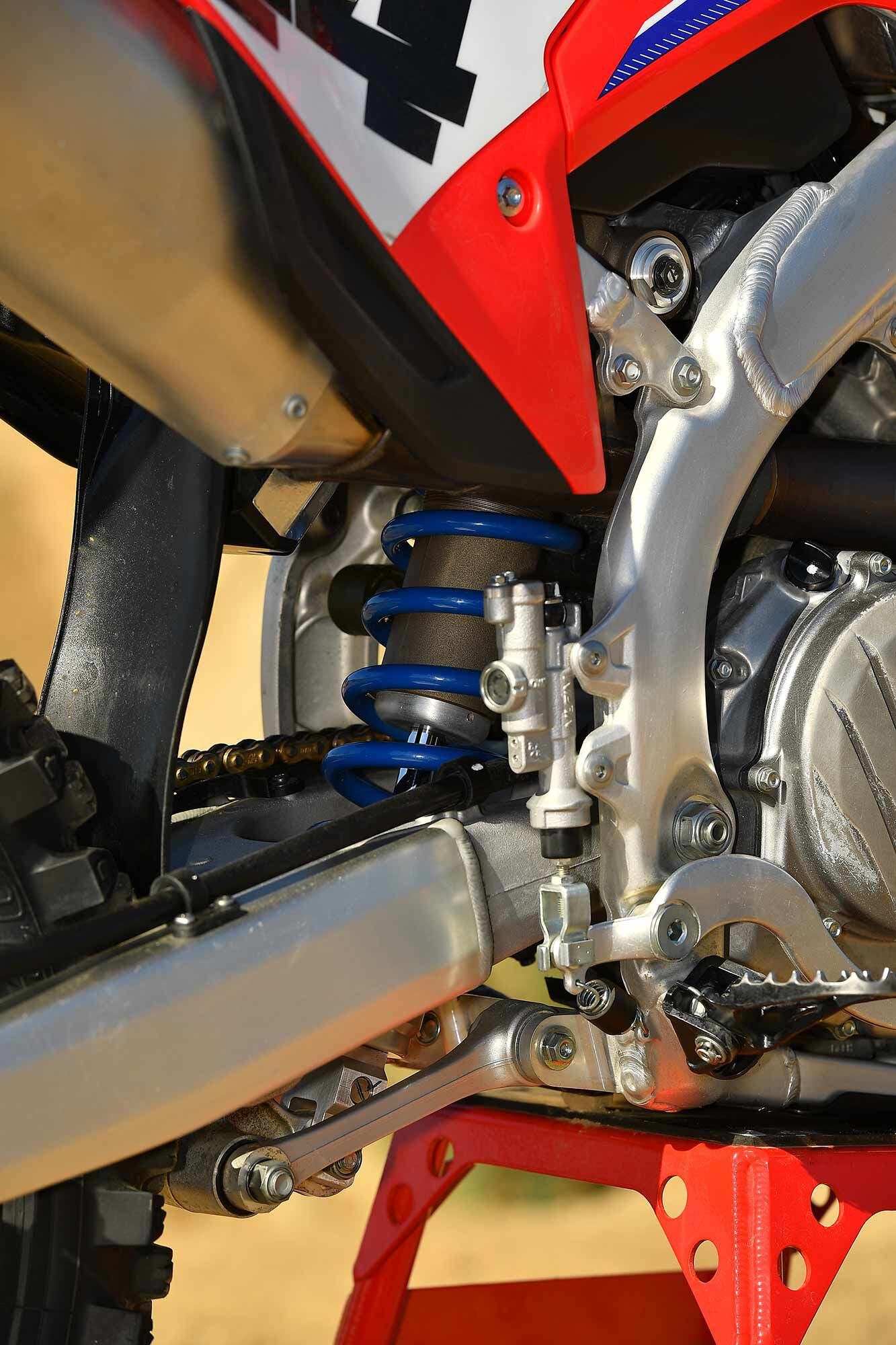 Blue shock spring and Sharpie suspension setup marks.