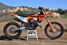 2025 KTM 125 XC on display stand right side profile