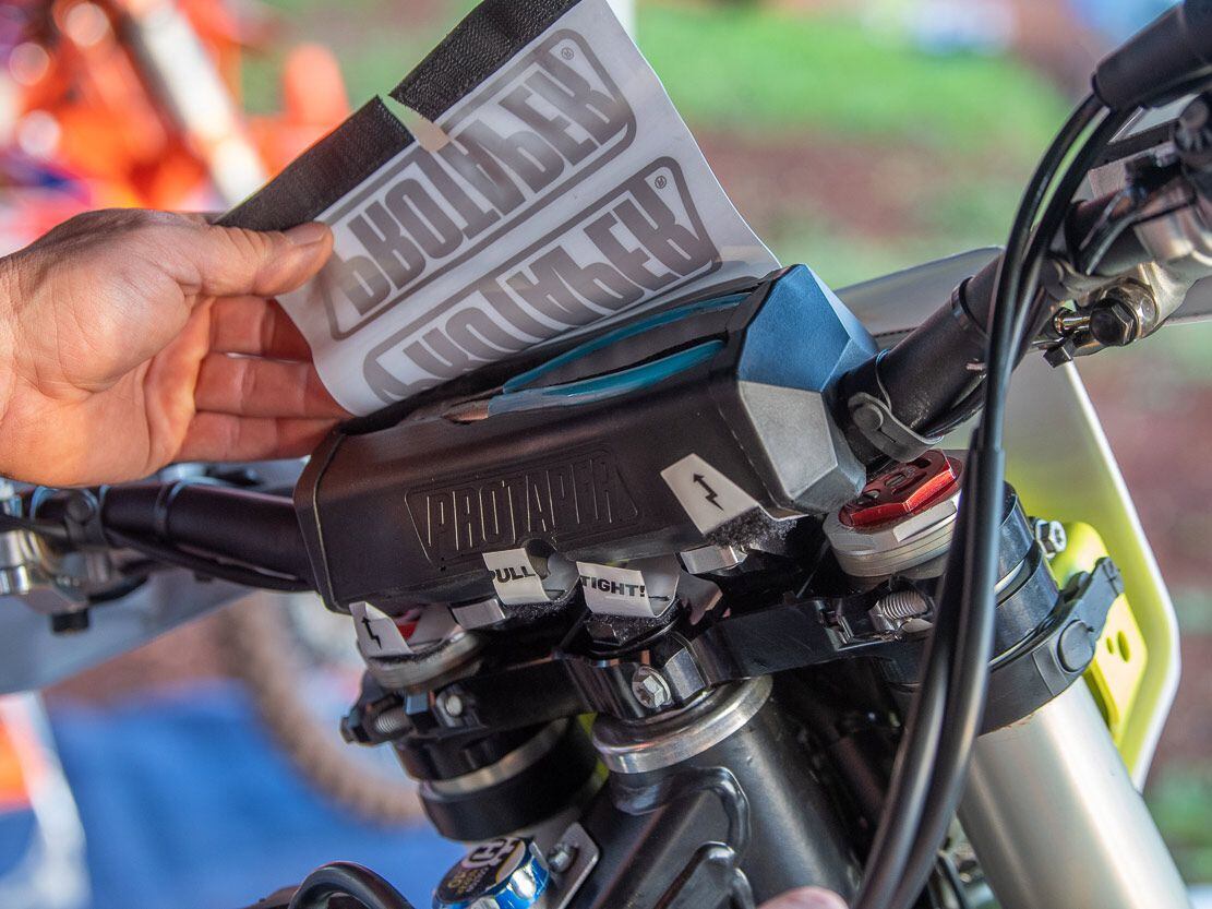 “One place I hide tools is in the bar pad. I carve out the ProTaper bar pad and put a pair of dykes in there. I have a spare shifter zip-tied inside of the frame and he can use the dykes to replace them. Also, in the airbox, I have a full rear brake pedal assembly ready to go. Then in his backpack, there will be a spare set of levers along with a couple minor tools to fix whatever on the track.”